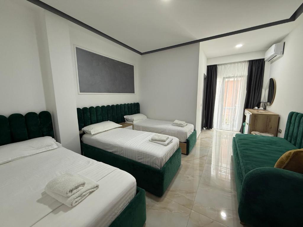 Postel nebo postele na pokoji v ubytování Hotel Leodori 1