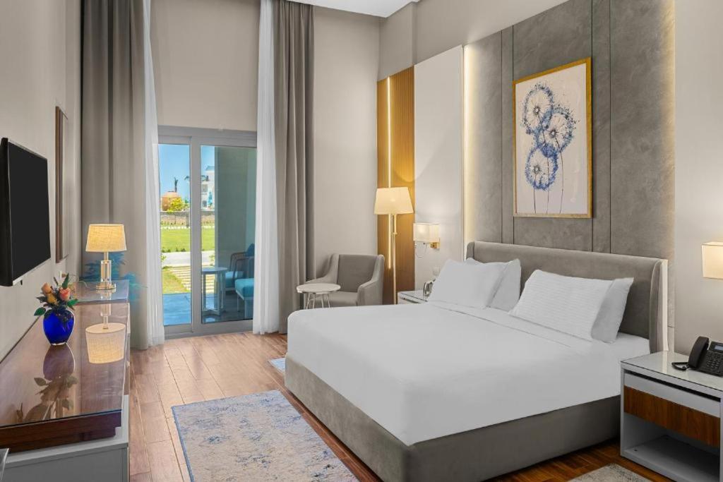 Postel nebo postele na pokoji v ubytování Gewan Luxury Resort