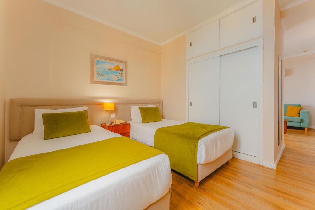 Postel nebo postele na pokoji v ubytování Duas Torres Hotel