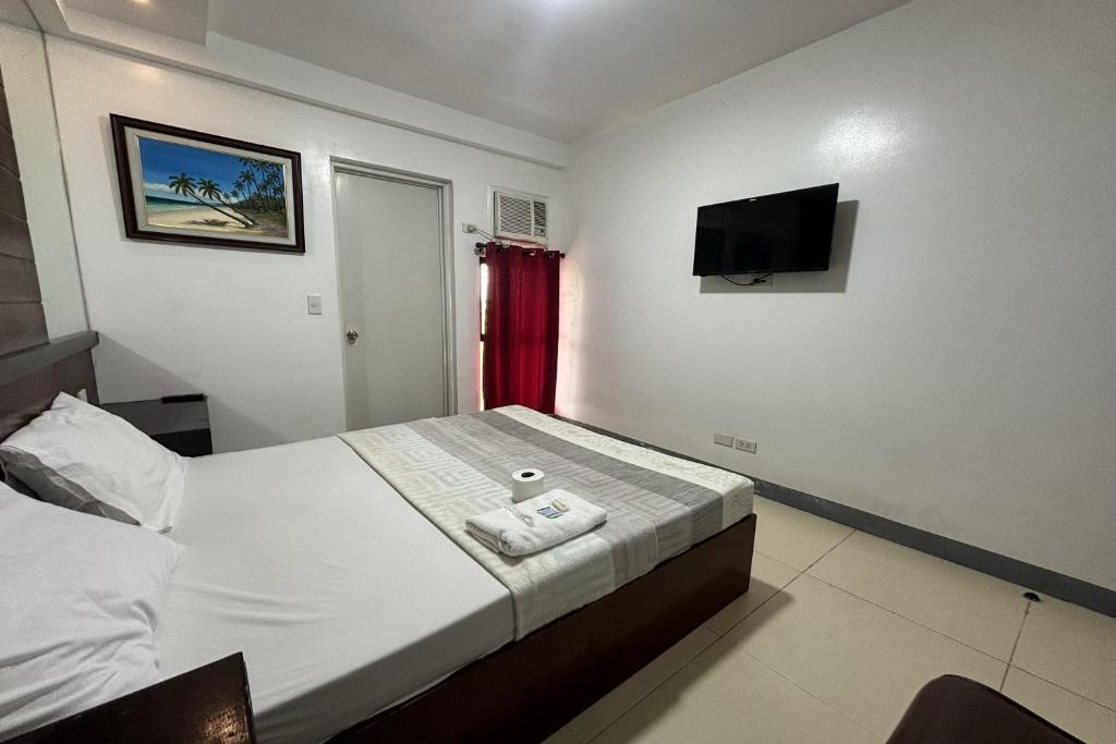 Postel nebo postele na pokoji v ubytování Yellowbell Hotel