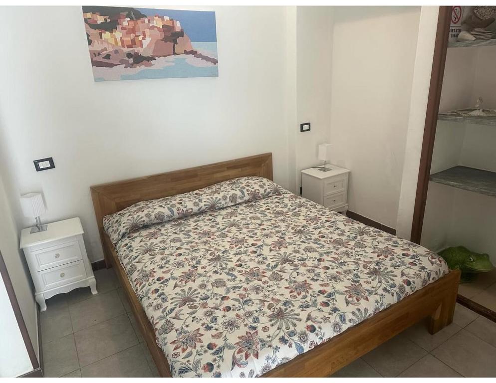 Postel nebo postele na pokoji v ubytování Affittacamere l'Acciuga