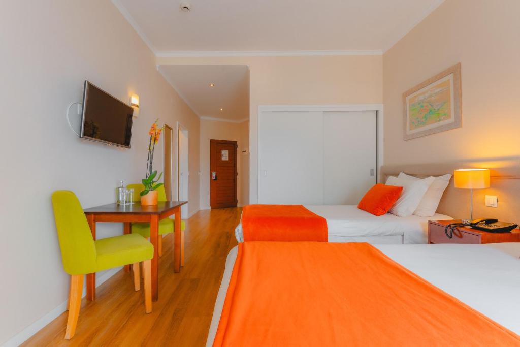 Postel nebo postele na pokoji v ubytování Duas Torres Hotel
