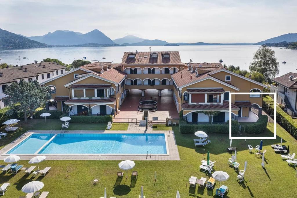 an aerial view of a house with a swimming pool at Lake's dream in Feriolo