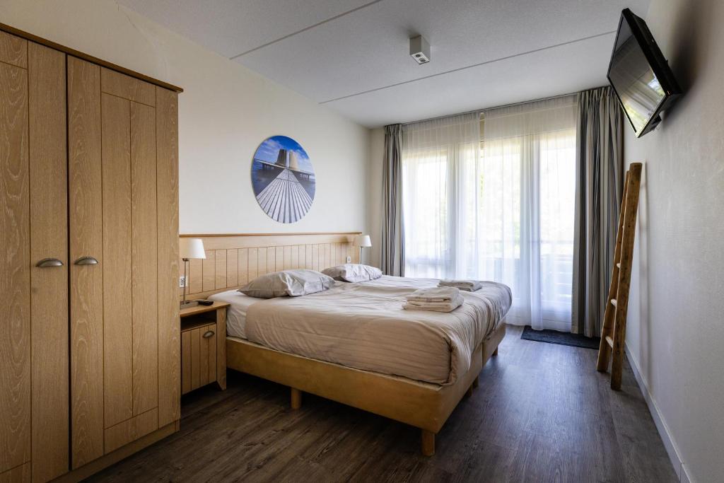 Postel nebo postele na pokoji v ubytování Résidence Terschelling