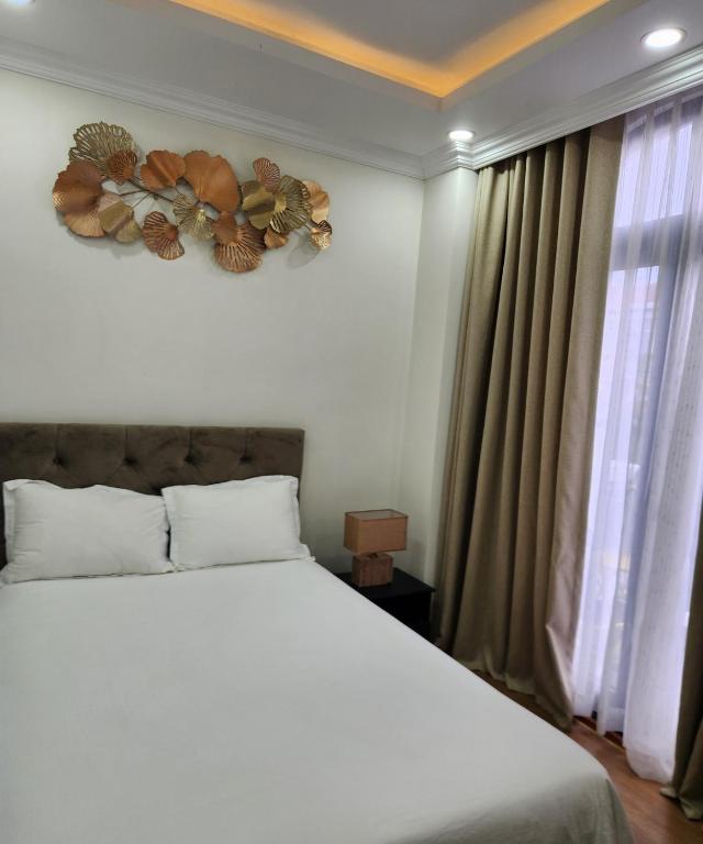 Postel nebo postele na pokoji v ubytování BREAKING DAWN- TAEYANG Hotel Phú Quốc