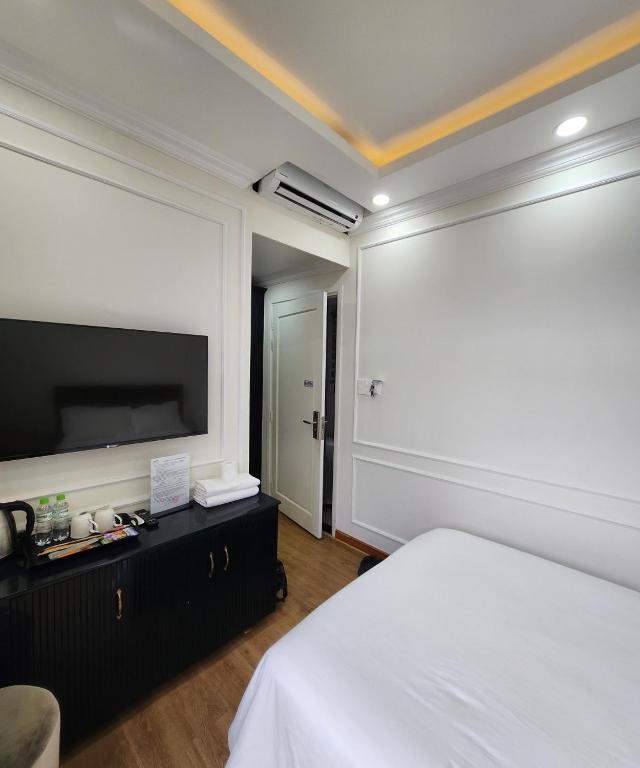 Postel nebo postele na pokoji v ubytování BREAKING DAWN- TAEYANG Hotel Phú Quốc
