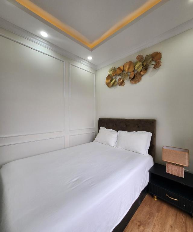 Postel nebo postele na pokoji v ubytování BREAKING DAWN- TAEYANG Hotel Phú Quốc