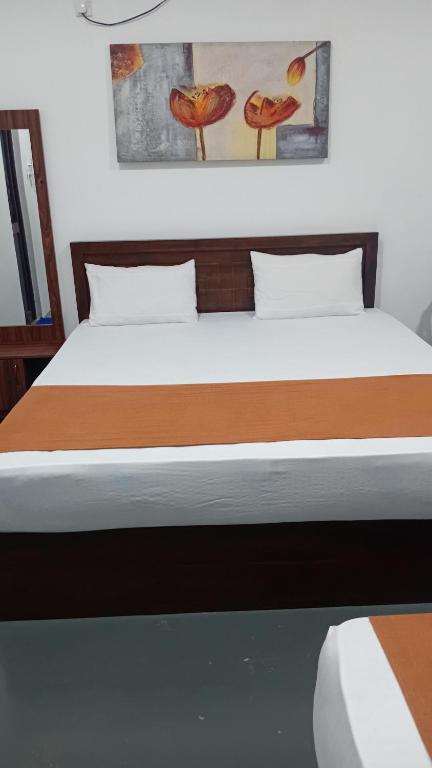 Postel nebo postele na pokoji v ubytování Leaf Dew Resort