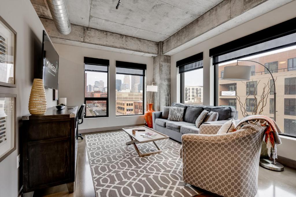 a living room with a couch and a table at Sable 409 - One Bedroom in Minneapolis