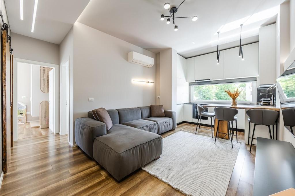 a living room with a couch and a table at Chloe's Central Apartment in Durrës