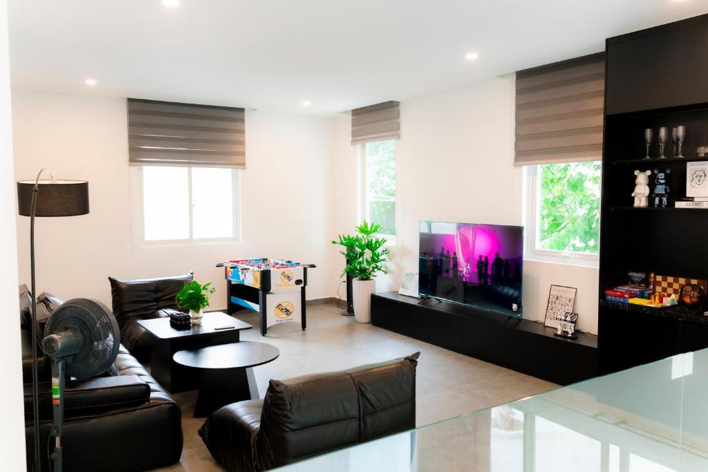 TV a/nebo společenská místnost v ubytování Villa 3B MAISON Signature