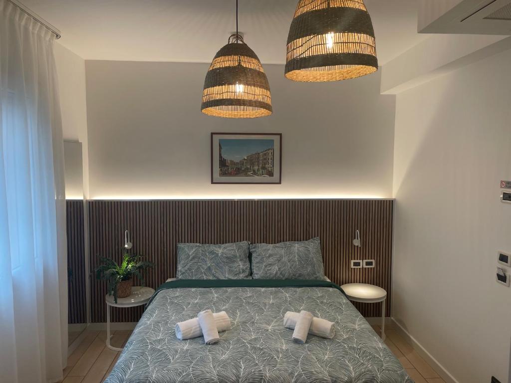 A bed or beds in a room at Hotel La Pergola di Venezia