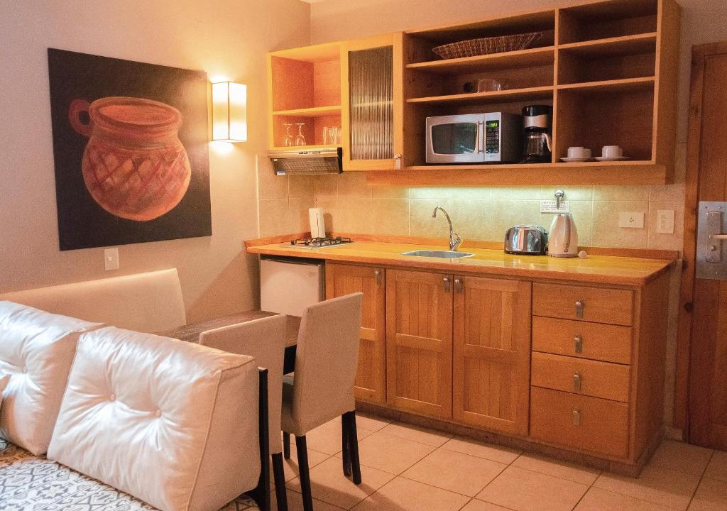 Kuchyň nebo kuchyňský kout v ubytování ONA Apart Hotel and Spa