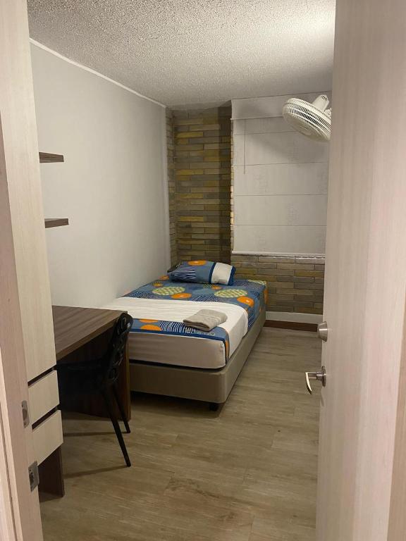 Postel nebo postele na pokoji v ubytování LivinnX Barranquilla