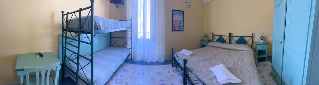 Postel nebo postele na pokoji v ubytování Hotel Savoia