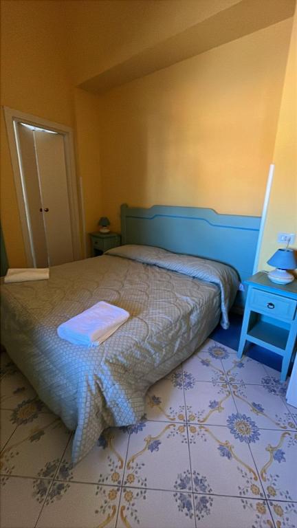 Postel nebo postele na pokoji v ubytování Hotel Savoia