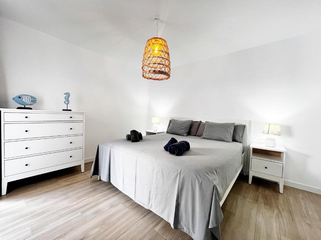Ένα ή περισσότερα κρεβάτια σε δωμάτιο στο FTV Holidays Homes - Home with You