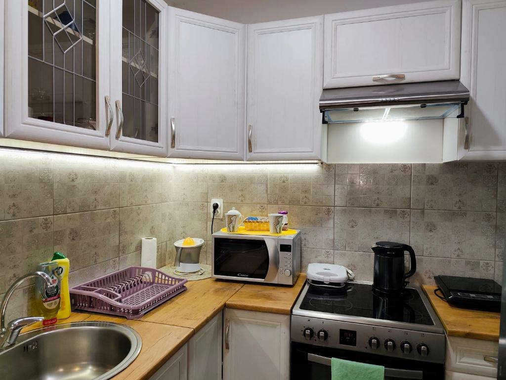 Kuchyň nebo kuchyňský kout v ubytování Apartman LARA