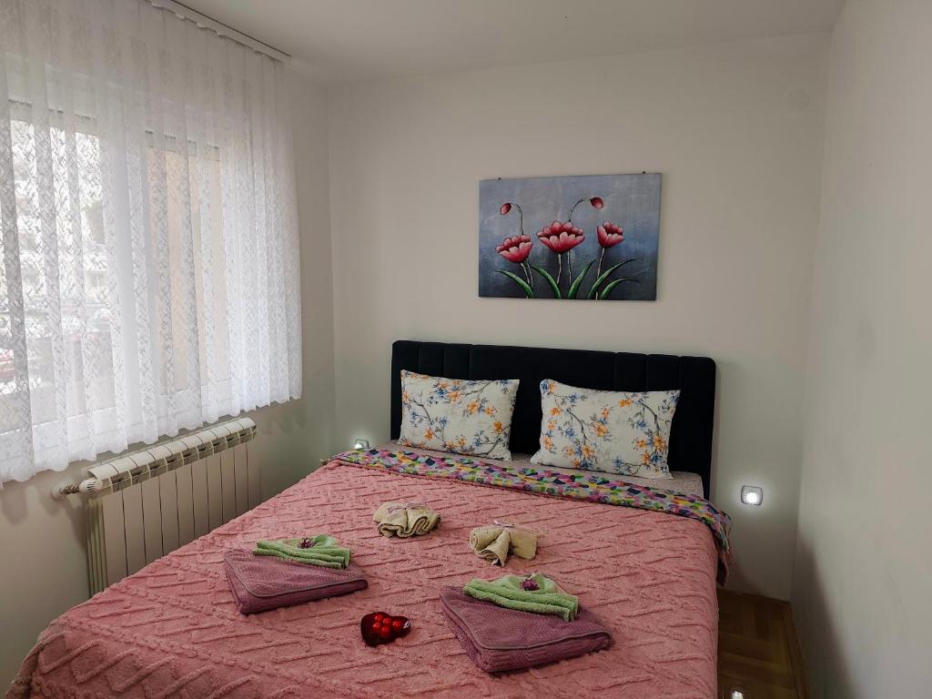 Postel nebo postele na pokoji v ubytování Apartman LARA