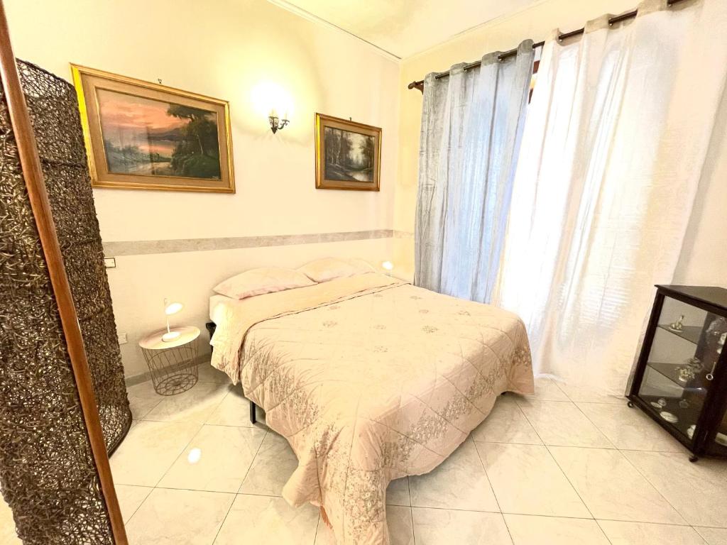 Łóżko lub łóżka w pokoju w obiekcie La Casa Di Lina