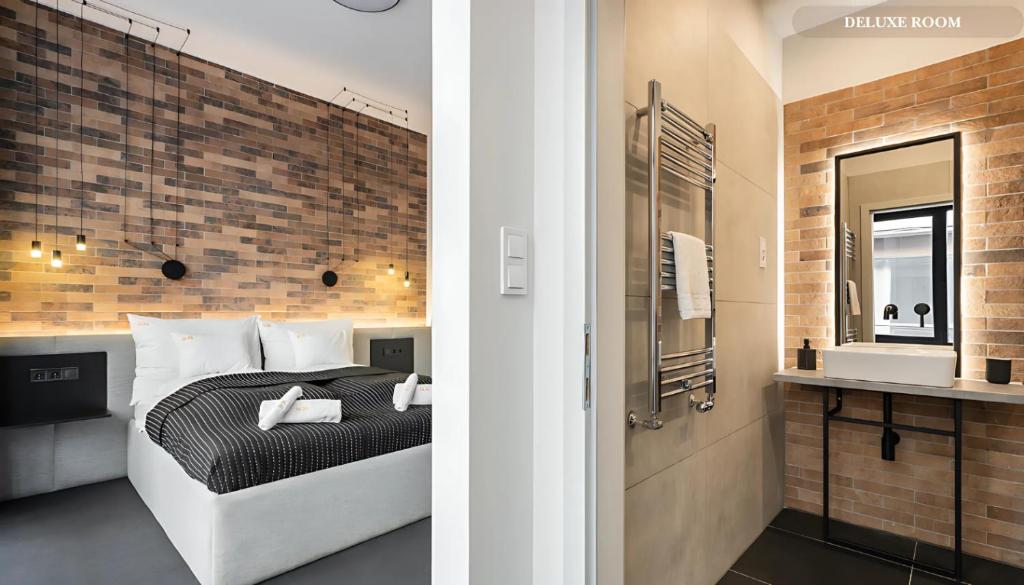 Postel nebo postele na pokoji v ubytování Váci Loft Suites
