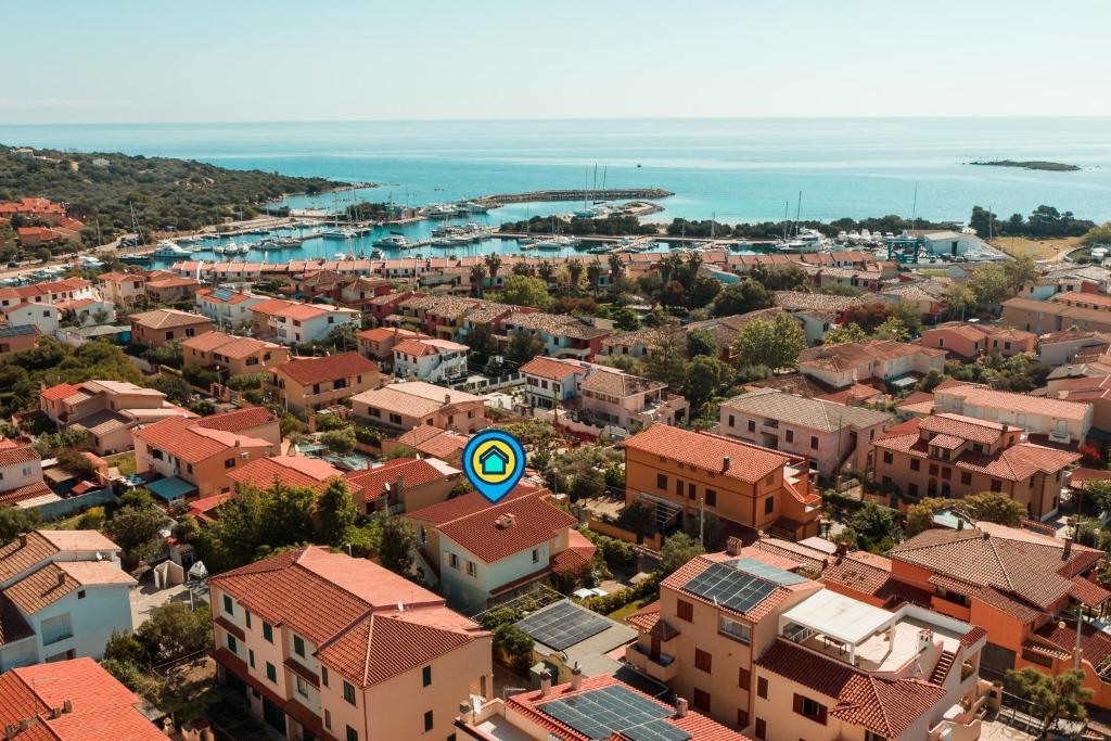 an aerial view of a city with houses and the ocean at Villa Antonia, 300 metres from the sea in Porto Ottiolu