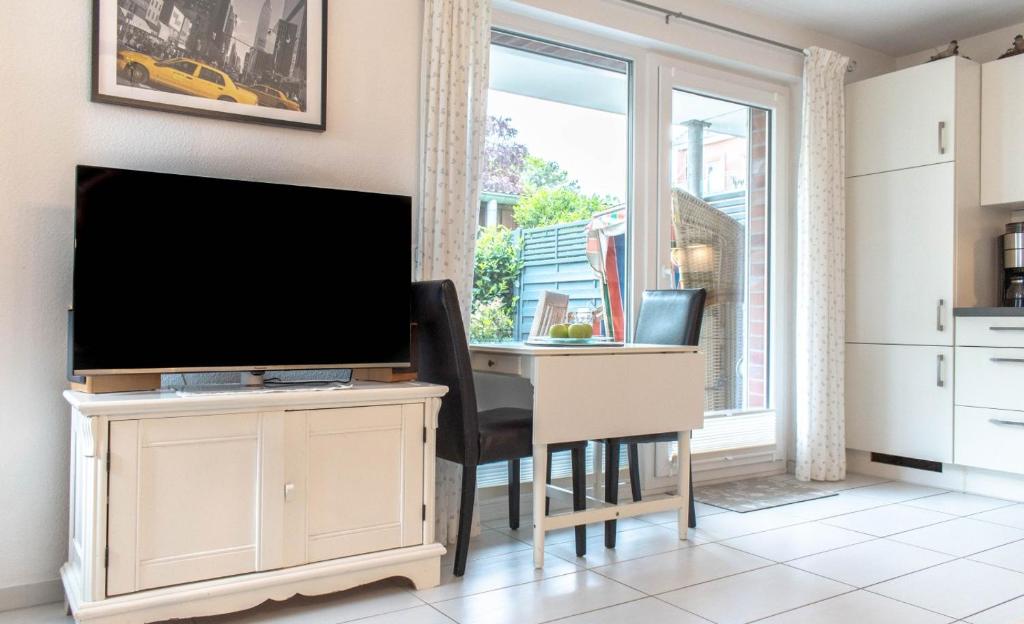 TV a/nebo společenská místnost v ubytování Ferienwohnung Mare Time 1