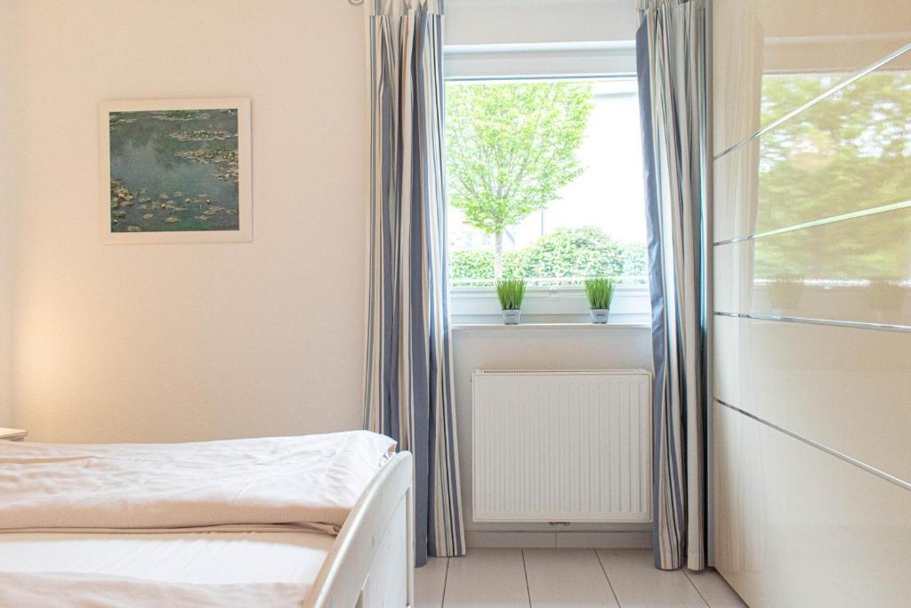 Postel nebo postele na pokoji v ubytování Ferienwohnung Mare Time 1