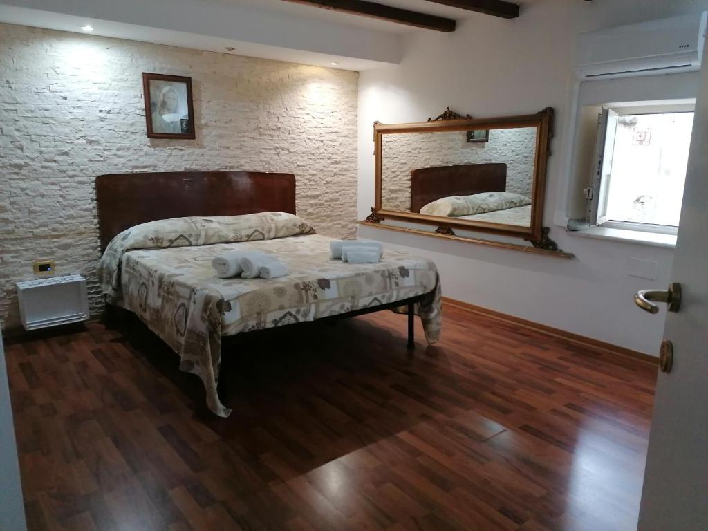 Postel nebo postele na pokoji v ubytování Mille e una notte house
