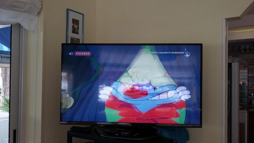 TV a/nebo společenská místnost v ubytování Hotel Garni Tahiti