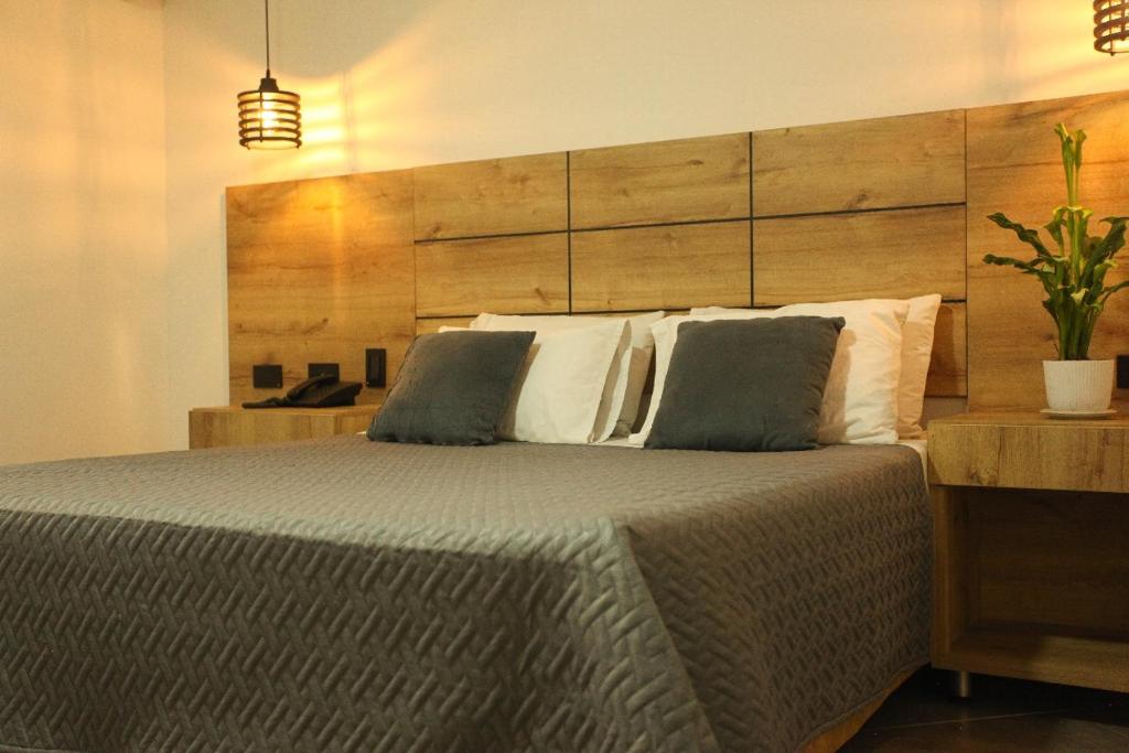 Postel nebo postele na pokoji v ubytování Hotel California Medellin