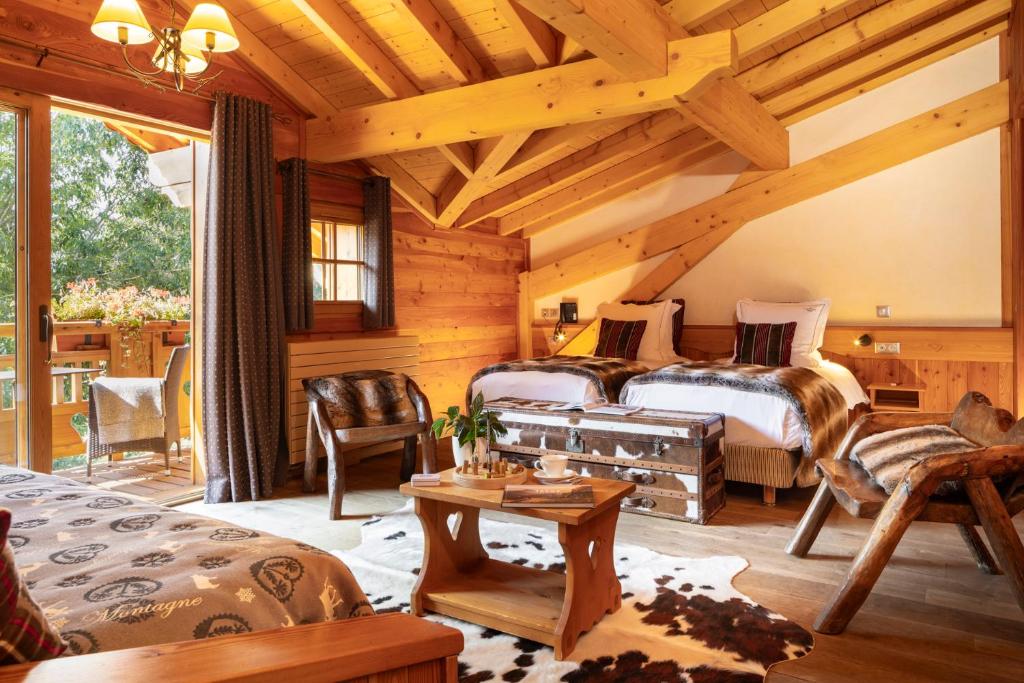 Кровать или кровати в номере Hôtel Chalet Mounier