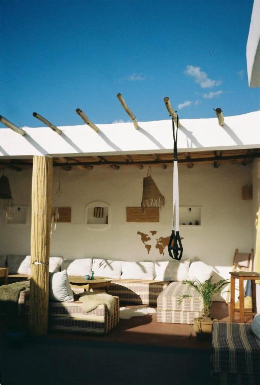 a patio with a couch and a pergola at Sun & Sea Lodge Ocean roof in Essaouira