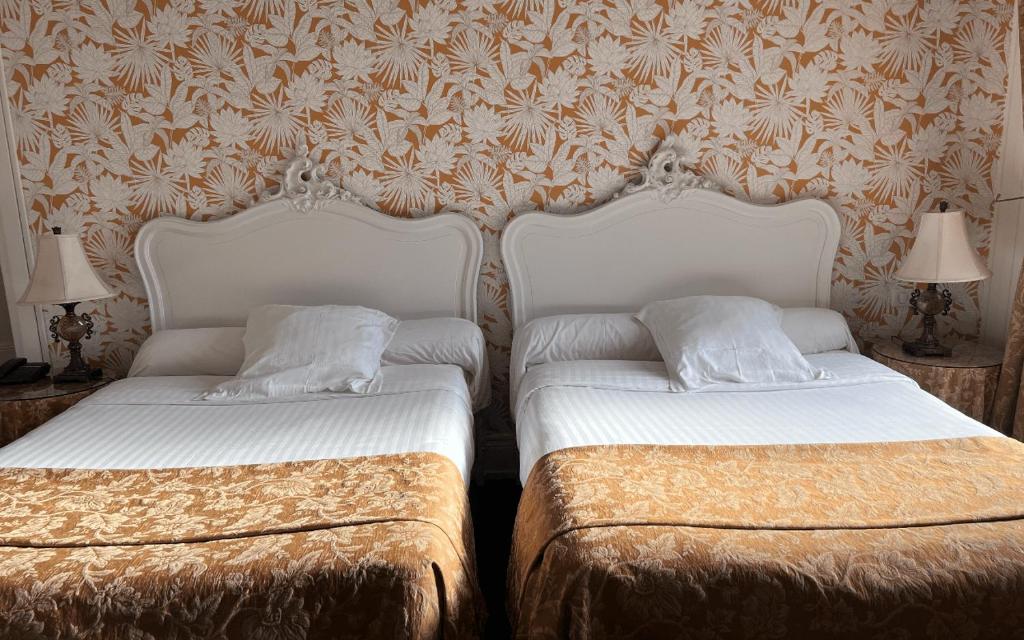Postel nebo postele na pokoji v ubytování Hotel Restaurant Du Parc