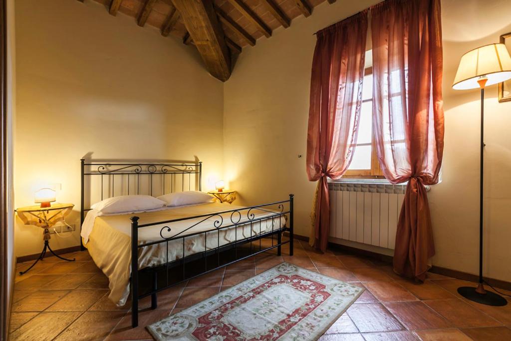 Postel nebo postele na pokoji v ubytování Il Conte Matto