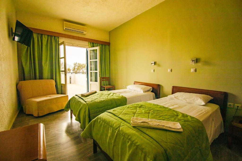 Кровать или кровати в номере Hotel Philoxenia