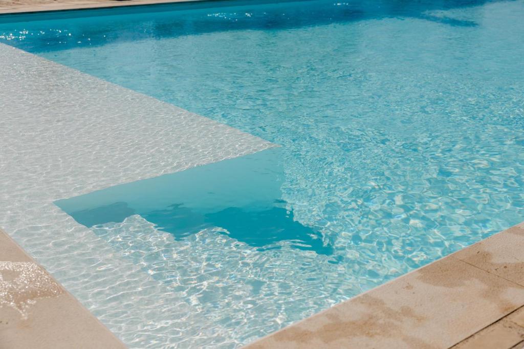 The swimming pool at or close to Villa Topazio