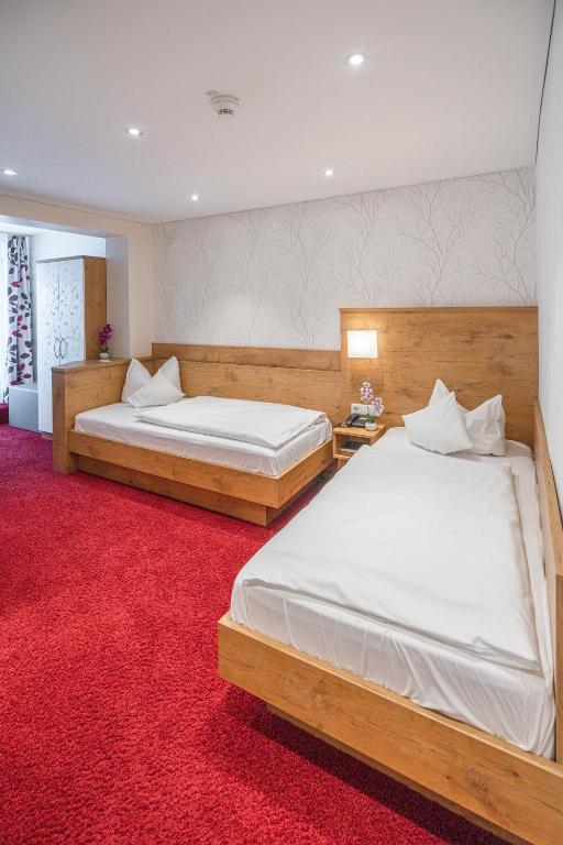 Postel nebo postele na pokoji v ubytování DEVA Hotel Renchtalblick