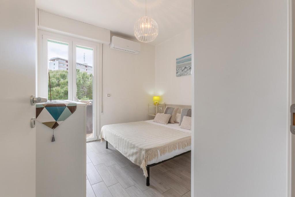 Postel nebo postele na pokoji v ubytování Lido degli Estensi Seaview Apartment