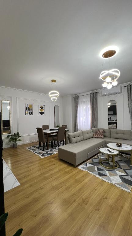 a living room with a couch and a table at Bulevar Mostar Old Bridge in Mostar