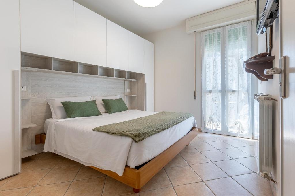 Postel nebo postele na pokoji v ubytování Lido Degli Estensi Flat con Balcone e Parcheggio!