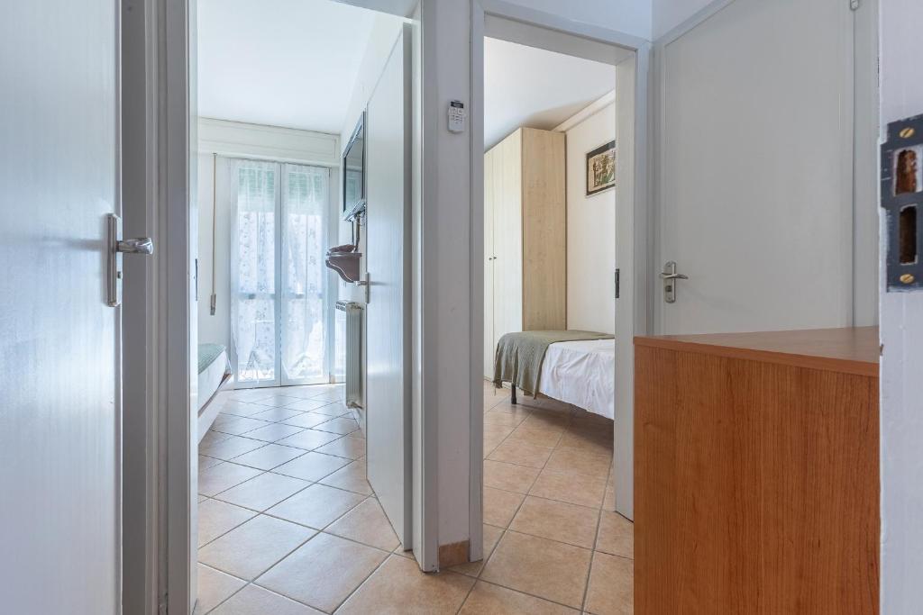 Postel nebo postele na pokoji v ubytování Lido Degli Estensi Flat con Balcone e Parcheggio!