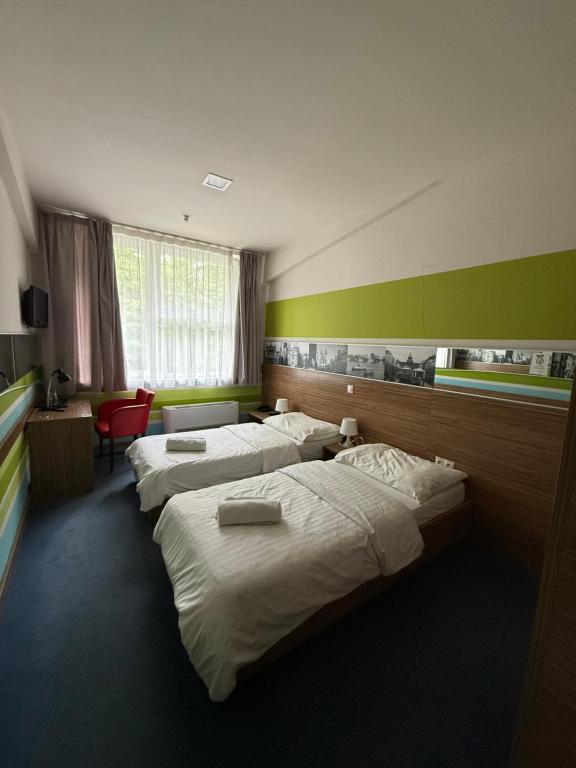 Postel nebo postele na pokoji v ubytování Hotelik Košice