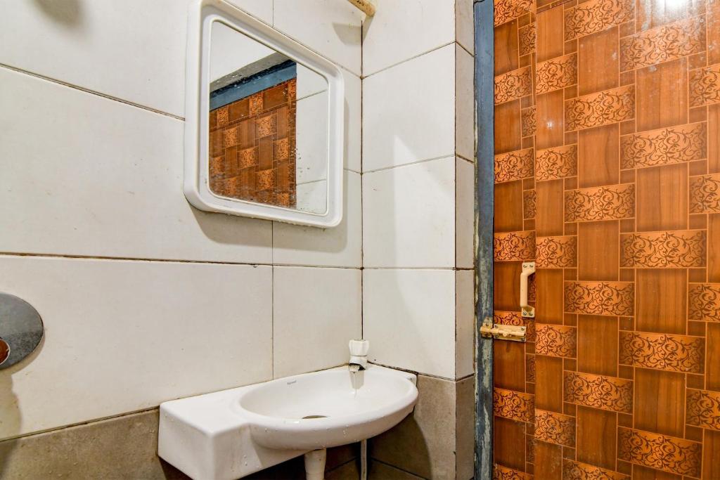 Koupelna v ubytování Hotel O NANDAN