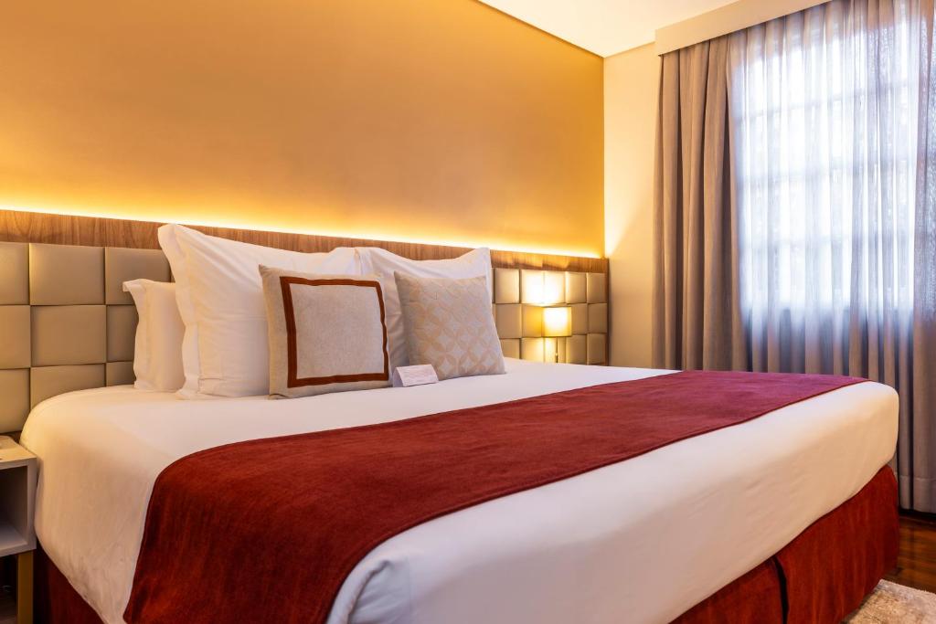Postel nebo postele na pokoji v ubytování Sanma Hotel