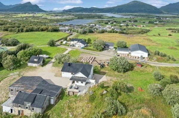 an aerial view of a house in a field at Private 4 bedroom getaway in Lofoten in Vestvågøya