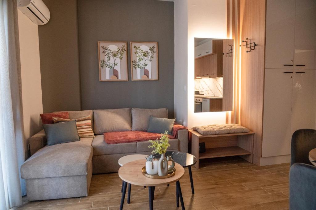 a living room with a couch and a table at Sandy'sLuxuryApartment in Alexandroupoli