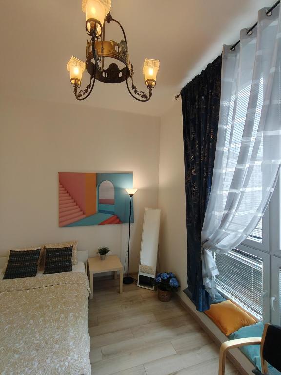 Posteľ alebo postele v izbe v ubytovaní City Center Studio Apartments