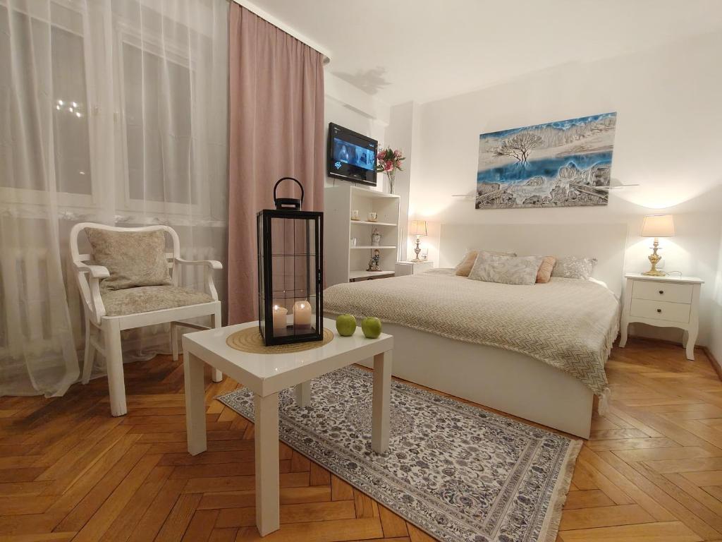 Posteľ alebo postele v izbe v ubytovaní City Center Studio Apartments
