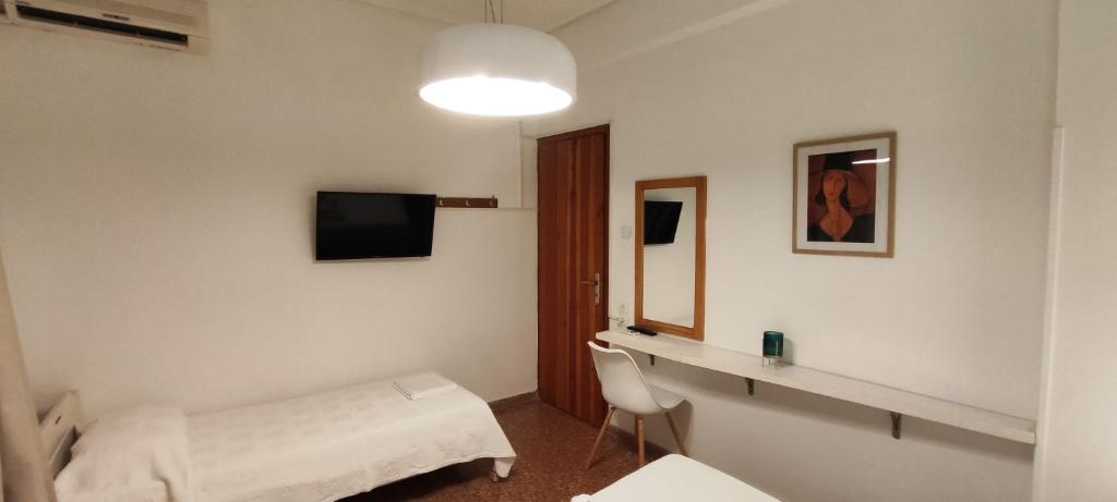 A television and/or entertainment centre at Papadioti Apartments